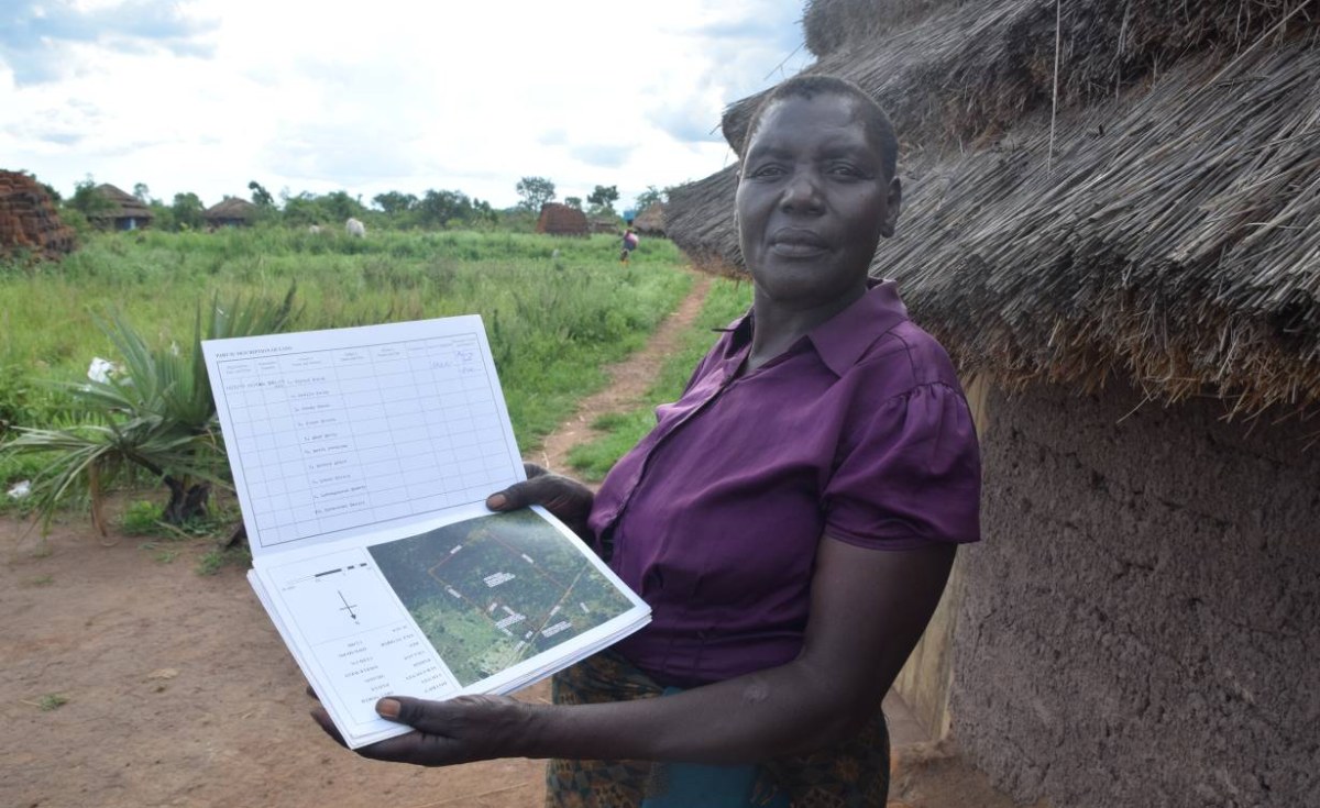 Santa Otyeka with her certificate of customary land ownership, in Pader district, Uganda.