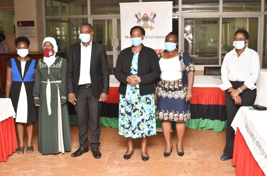 The University Librarian-Dr. Helen Byamugisha (3rd R) and the Buganda Land Board CEO’s Representative-Mr. Kizito Bashir (3rd L) with the Project Team; PI-Ms. Rhoda Nalubega (2nd R), Ms. Monica Naluwooza (R), Ms. Racheal Nabbosa (L) and Ms. Sara Maka (2nd L) at the dissemination event held on 28th May 2021 in the Main Library, Makerere University.