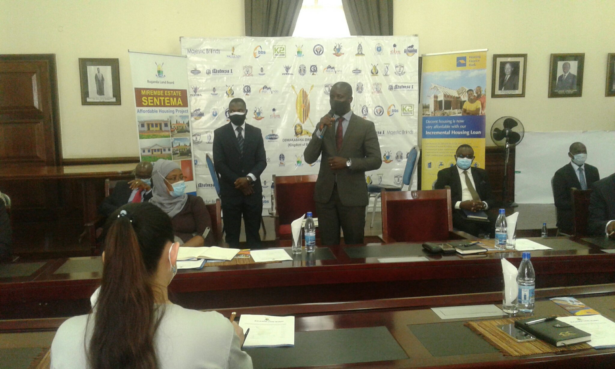 Buganda Land Board CEO, Simon Kabogoza, speaking at a ceremony about enabling those who wish to get houses in Sentema have access to mortgage services from Housing Finance Bank.