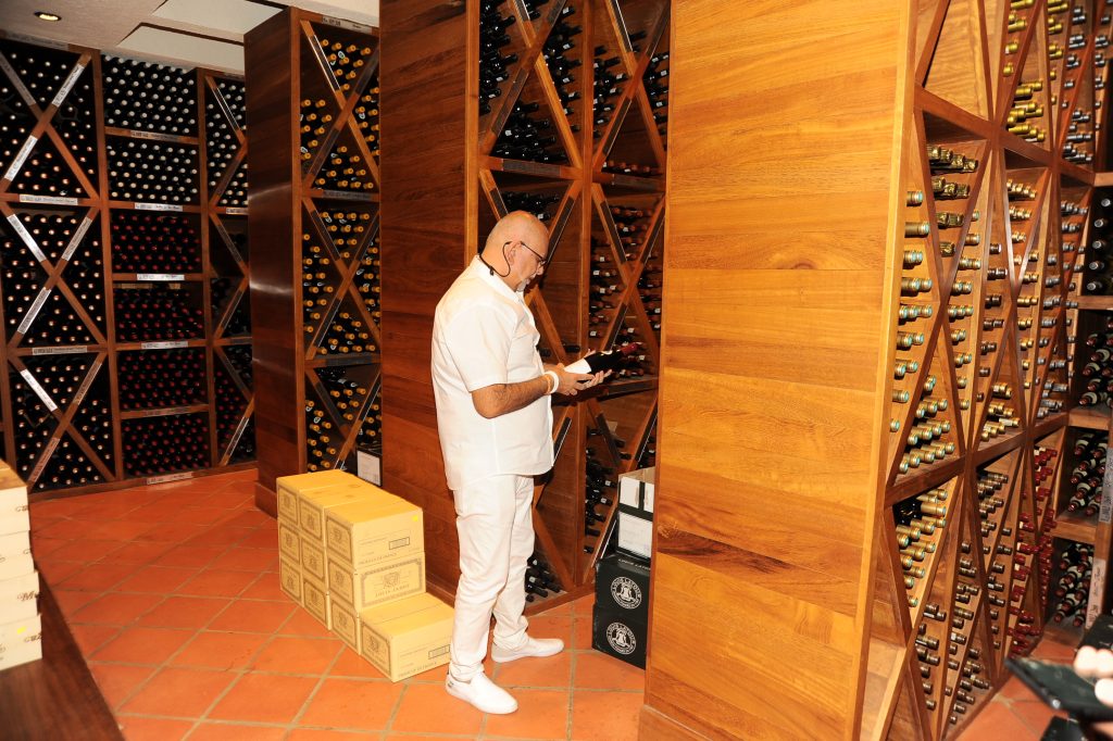 A temperature-controlled wine cellar with 33,000 bottles of 200 different wines and whiskeys.