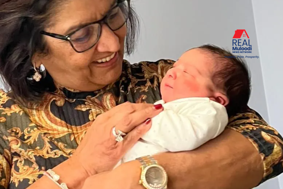 An overjoyed Jyotsna Ruparelia holding her beautiful baby granddaughter
