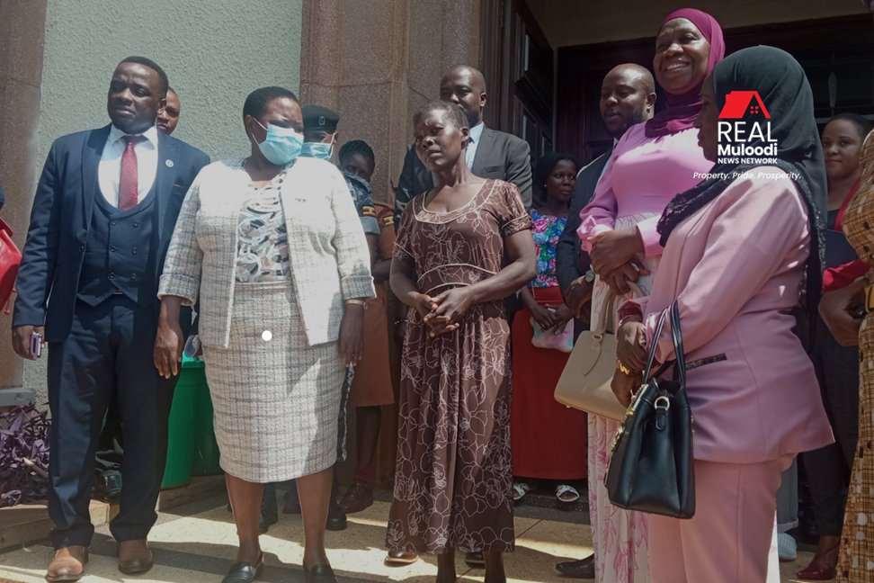 Prime Minister Nabbanja with Gertrude Nalule outside Mengo court.