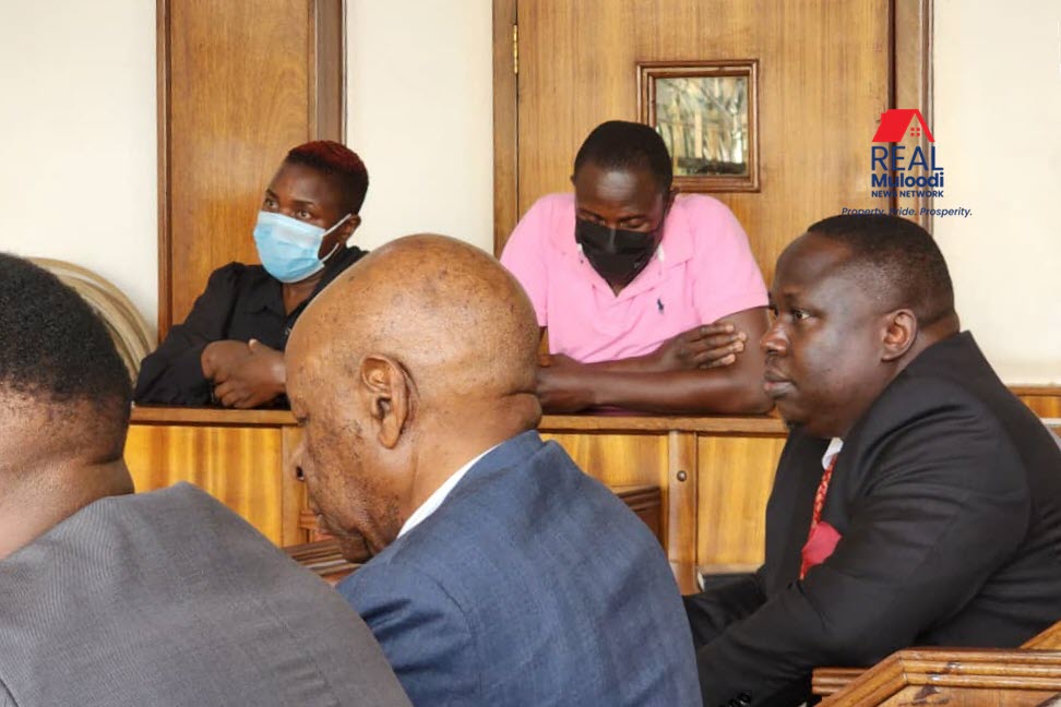 Tycoon Christine Nabukeera and her son Vincent Mawanda in court dock below are the team of lawyers representing them lead by Dusman Kabega centre.