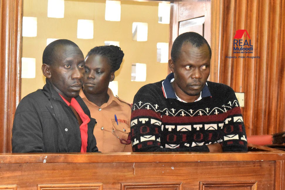 The accused land grabbing fraudsters, Geoffrey Sekamanya and Vicent Musiige, appearing before the Masaka Chief Magistrate Court